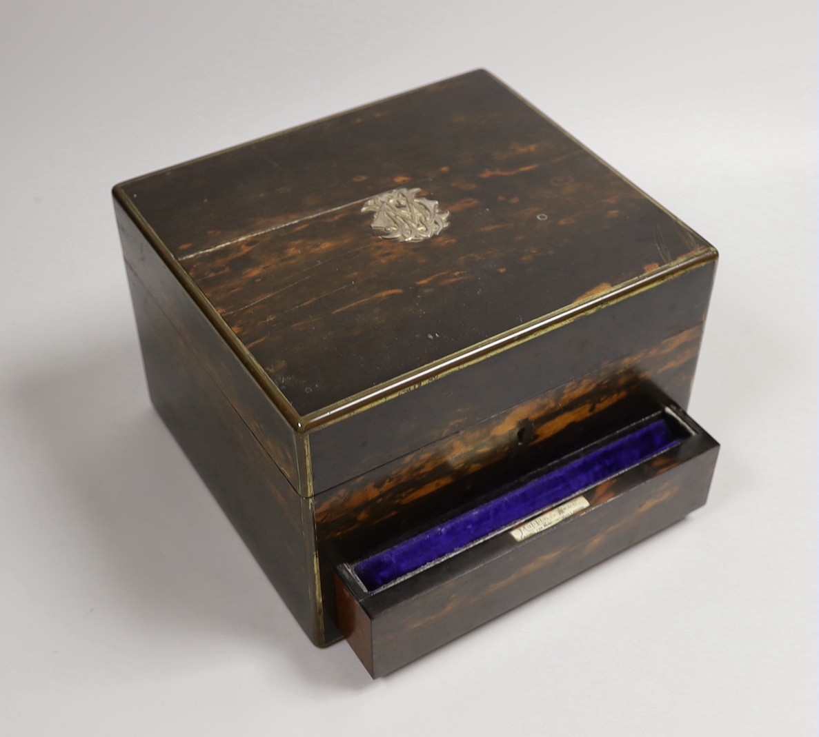 A late Victorian Mappin & Webb coromandel wood toilet box, containing ten silver mounted toilet jars, George Betjemann & Sons, London, 1895, box 21.2cm, mechanism for drawer a.f.